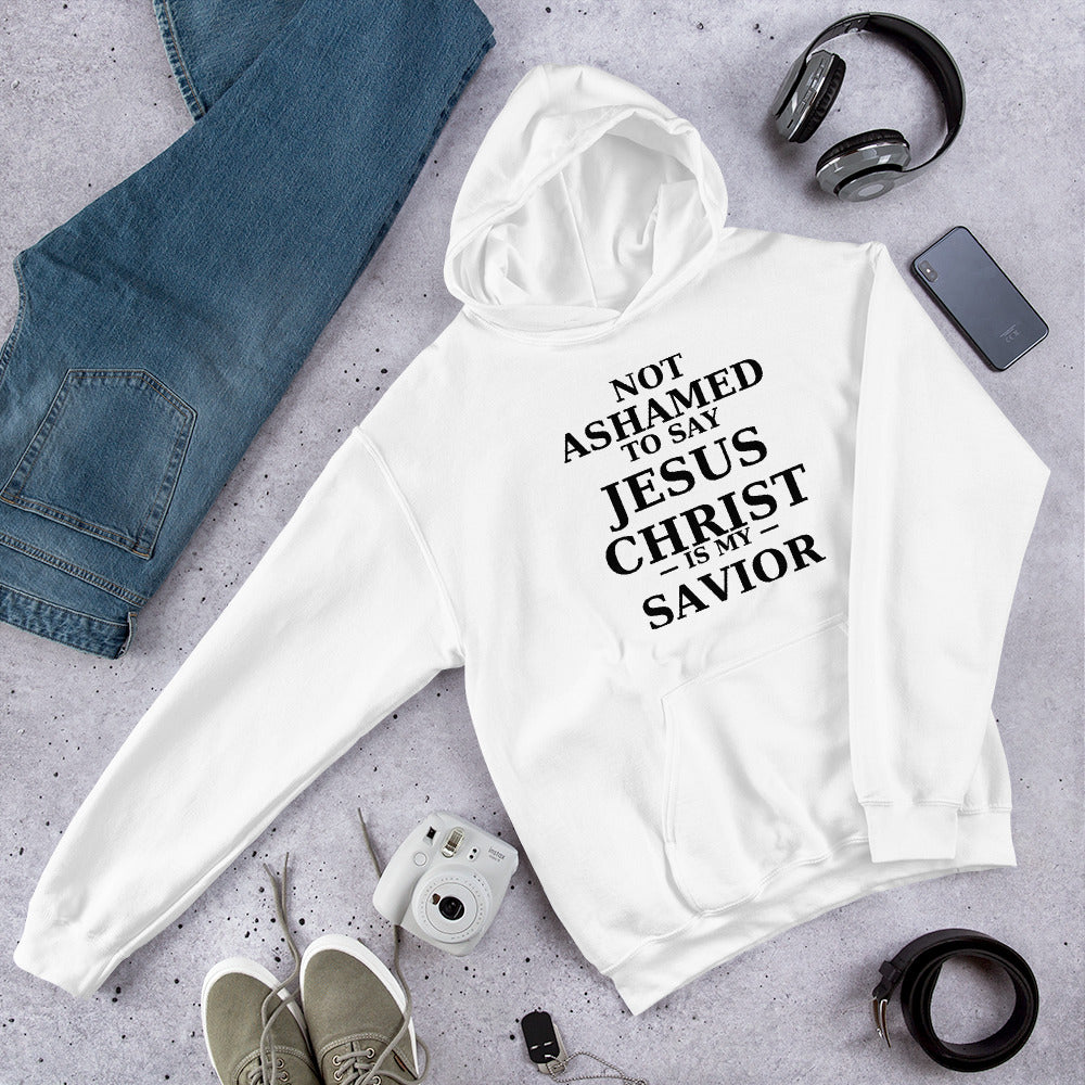 “White Christian hoodie with the bold faith message ‘Not Ashamed to Say Jesus Is My Savior’ in modern typography. Inspirational Scripture-based apparel for evangelism and everyday Christian streetwear.”