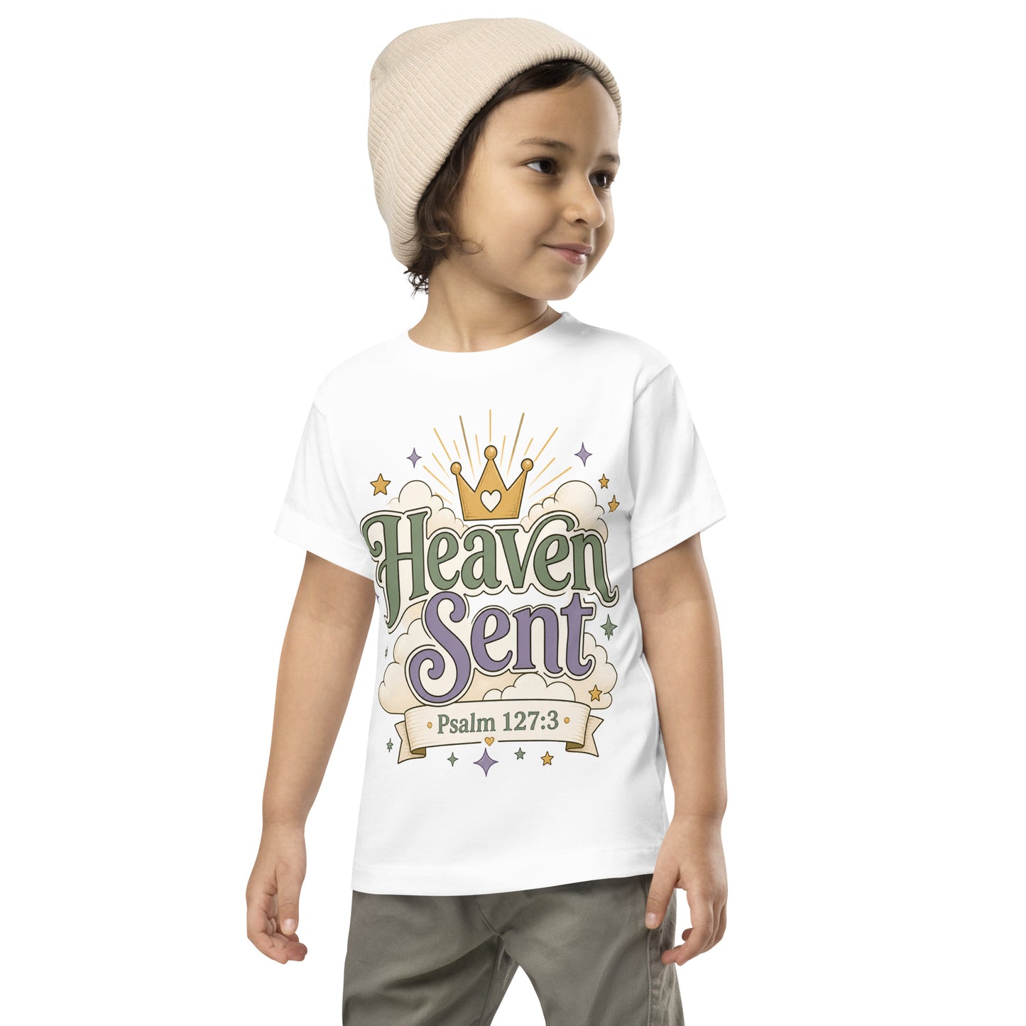 Christian toddler shirt design reading Heaven Sent with Psalm 127:3, featuring a crown, clouds, stars, and soft green, lavender, cream, and gold colors.