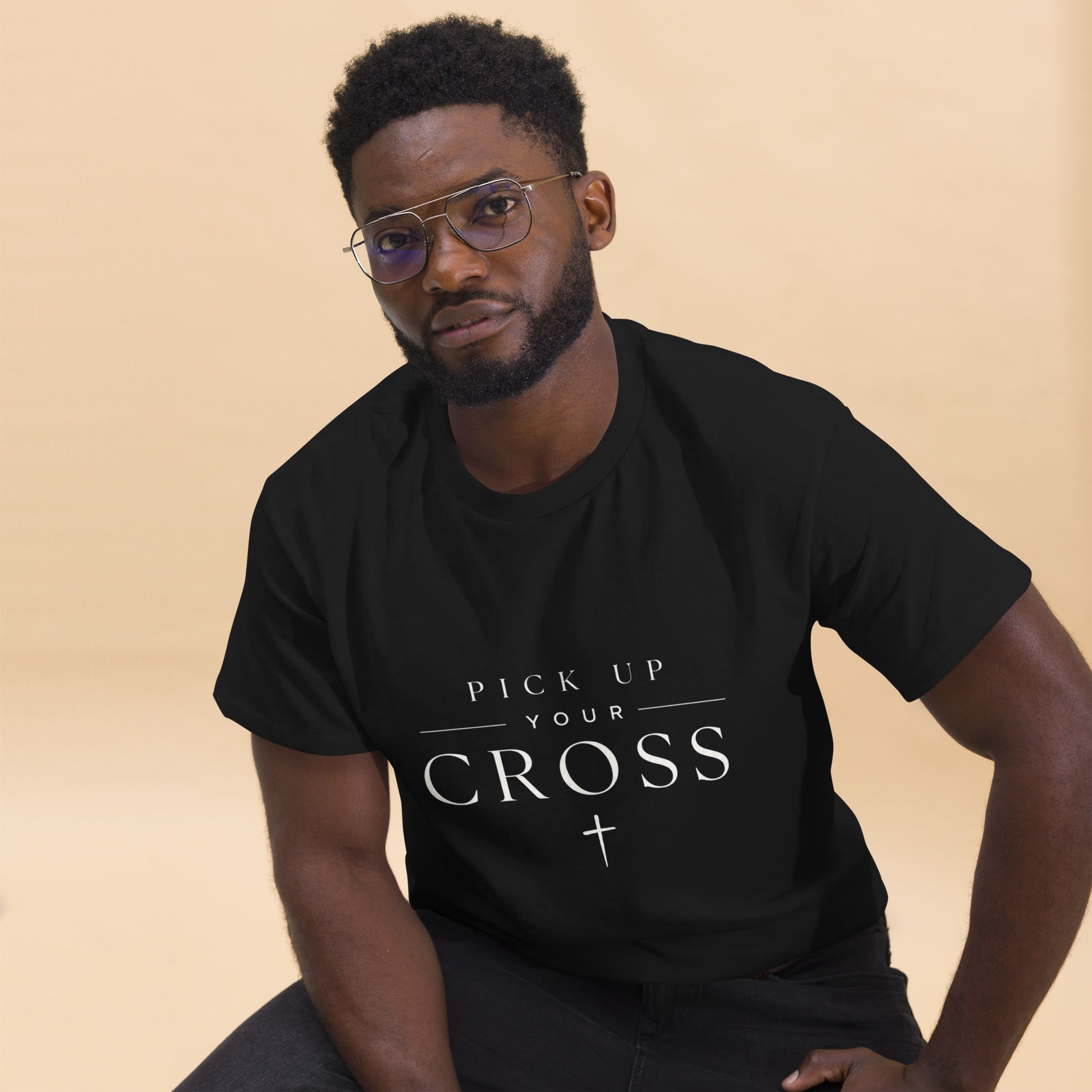 Black Christian T-shirt featuring “Pick Up Your Cross” bold faith statement design inspired by Luke 9:23, streetwear-style gospel apparel.