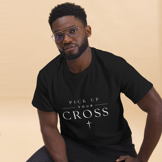 Black Christian T-shirt featuring “Pick Up Your Cross” bold faith statement design inspired by Luke 9:23, streetwear-style gospel apparel.