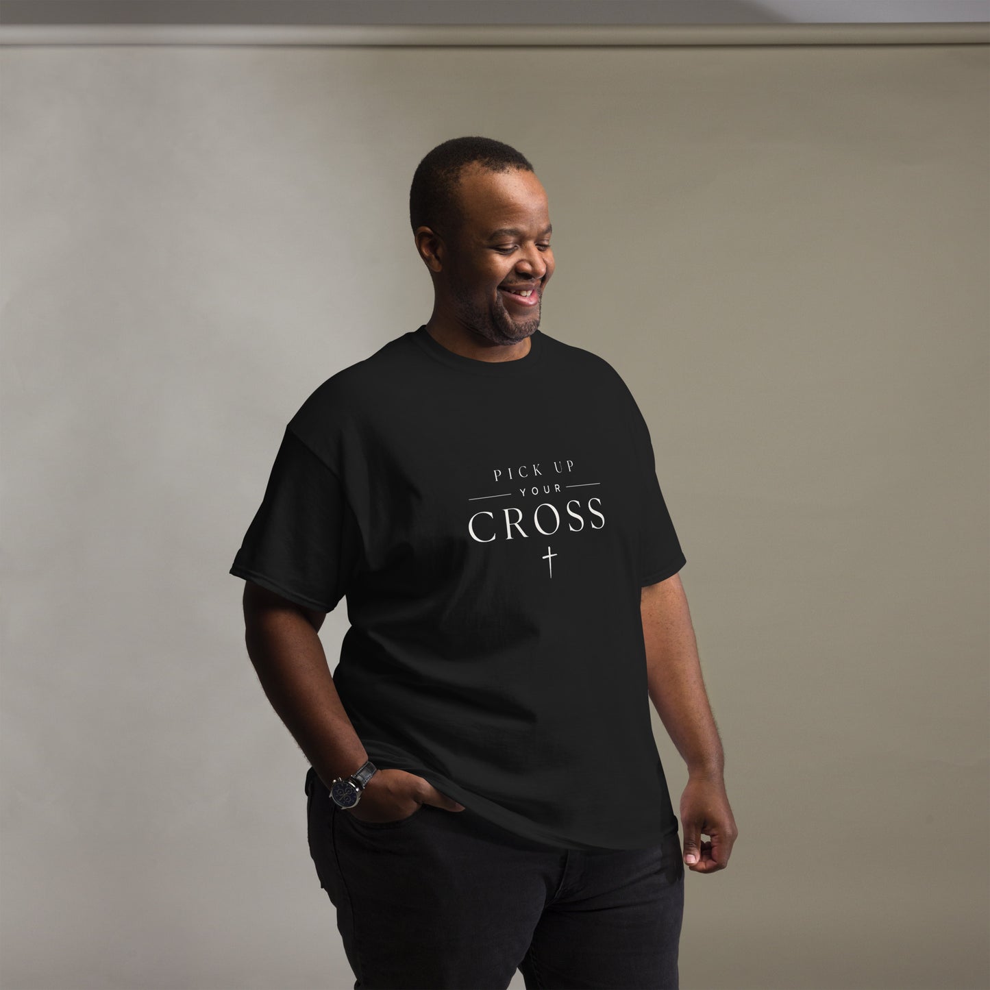 Black Christian T-shirt featuring “Pick Up Your Cross” bold faith statement design inspired by Luke 9:23, streetwear-style gospel apparel.
