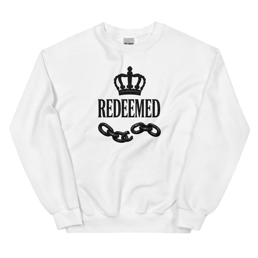 White sweatshirt with 'REDEEMED' text and chain design on a white background