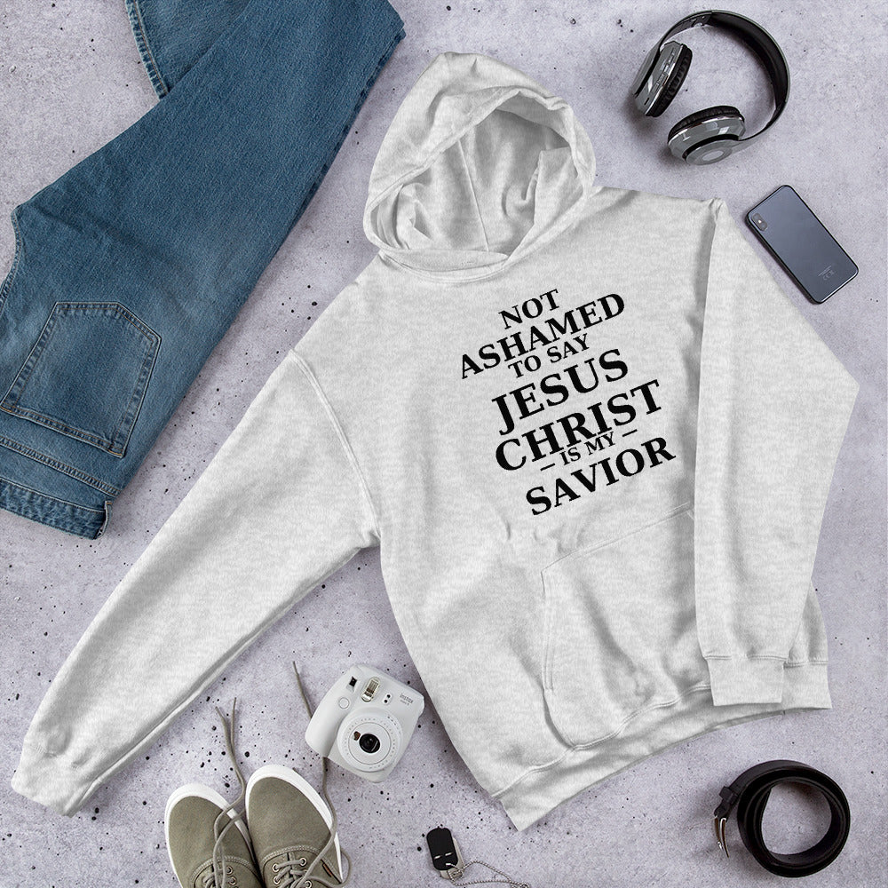 “Grey Christian hoodie with the bold faith message ‘Not Ashamed to Say Jesus Is My Savior’ in modern typography. Inspirational Scripture-based apparel for evangelism and everyday Christian streetwear.”