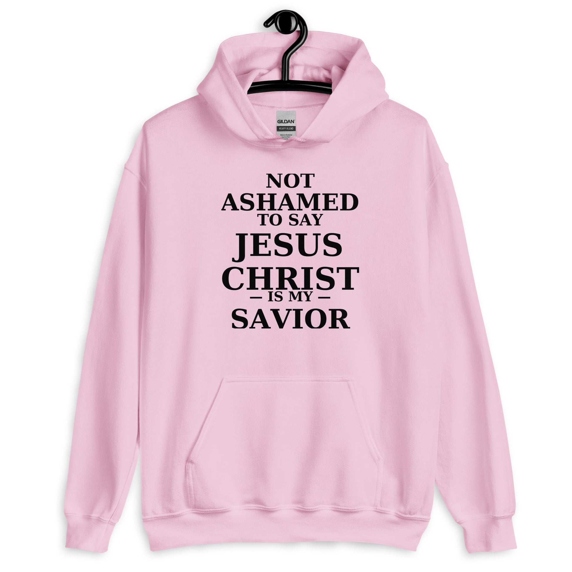 “Pink Christian hoodie with the bold faith message ‘Not Ashamed to Say Jesus Is My Savior’ in modern typography. Inspirational Scripture-based apparel for evangelism and everyday Christian streetwear.