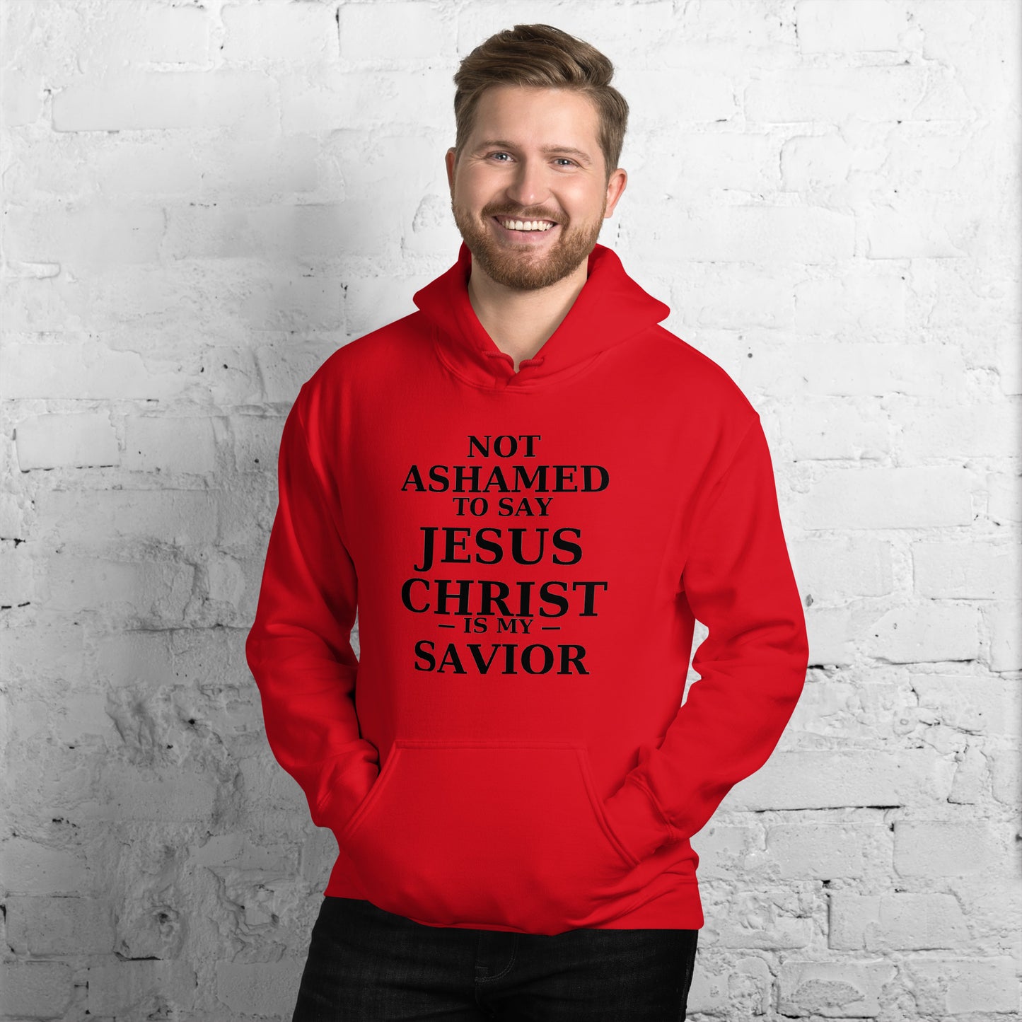 “Red Christian hoodie with the bold faith message ‘Not Ashamed to Say Jesus Is My Savior’ in modern typography. Inspirational Scripture-based apparel for evangelism and everyday Christian streetwear.”