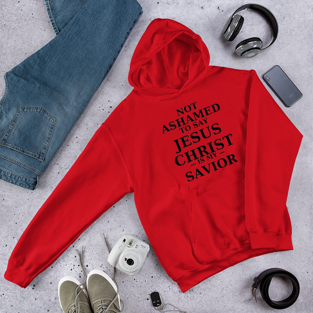 “Red Christian hoodie with the bold faith message ‘Not Ashamed to Say Jesus Is My Savior’ in modern typography. Inspirational Scripture-based apparel for evangelism and everyday Christian streetwear.”