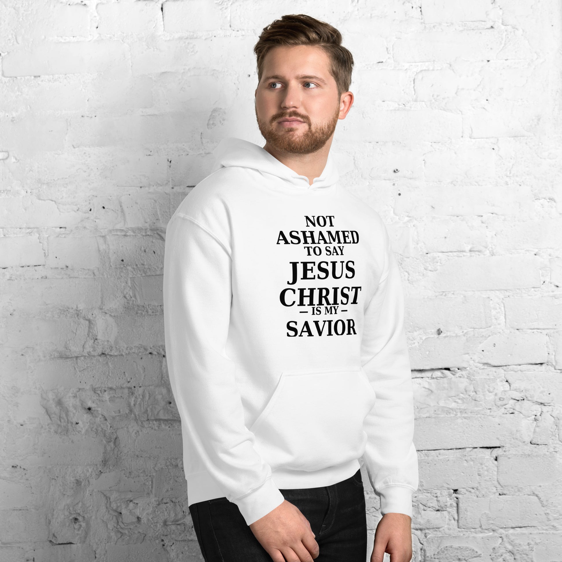 “White Christian hoodie with the bold faith message ‘Not Ashamed to Say Jesus Is My Savior’ in modern typography. Inspirational Scripture-based apparel for evangelism and everyday Christian streetwear.”