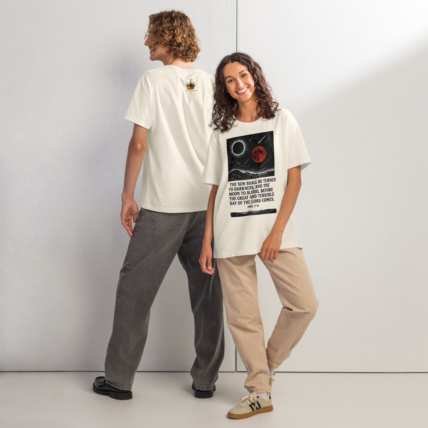 Two people wearing white t-shirts with graphic designs, standing side by side against a plain background.