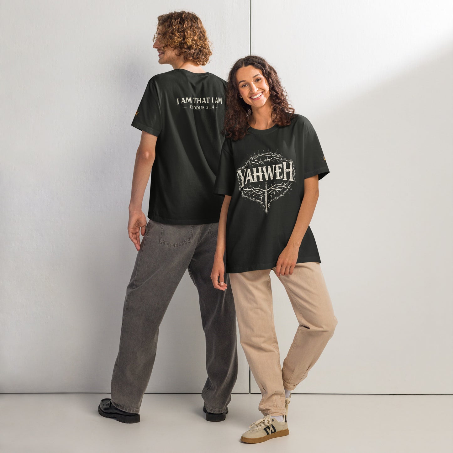 Oversized washed black Christian streetwear t-shirt featuring distressed YAHWEH typography with crown of thorns and sword design