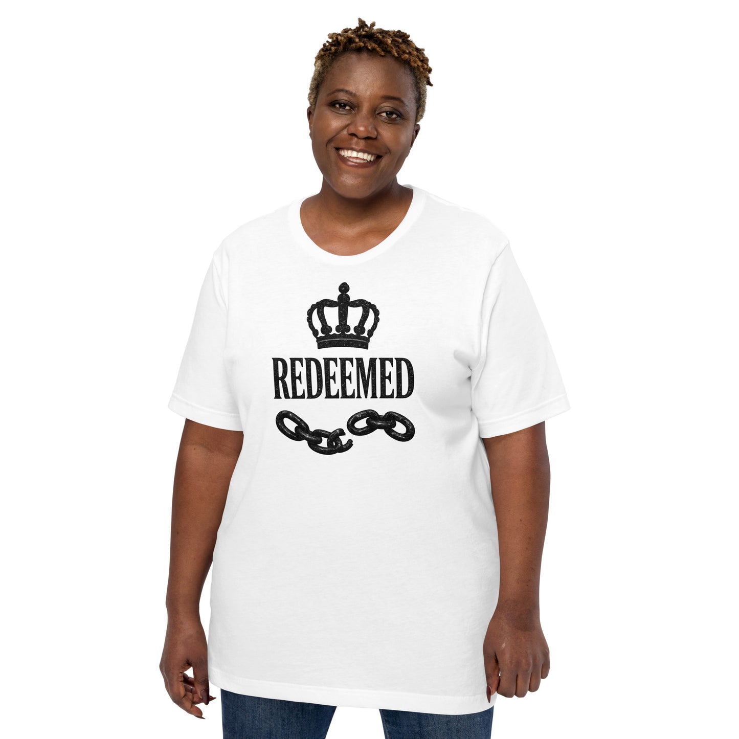 Christian t-shirt featuring a black crown, broken chains, and Redeemed typography in luxury faith streetwear style.