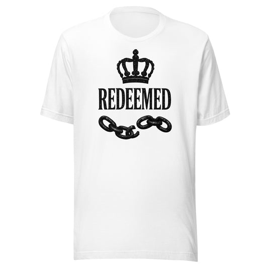 Christian t-shirt featuring a black crown, broken chains, and Redeemed typography in luxury faith streetwear style.