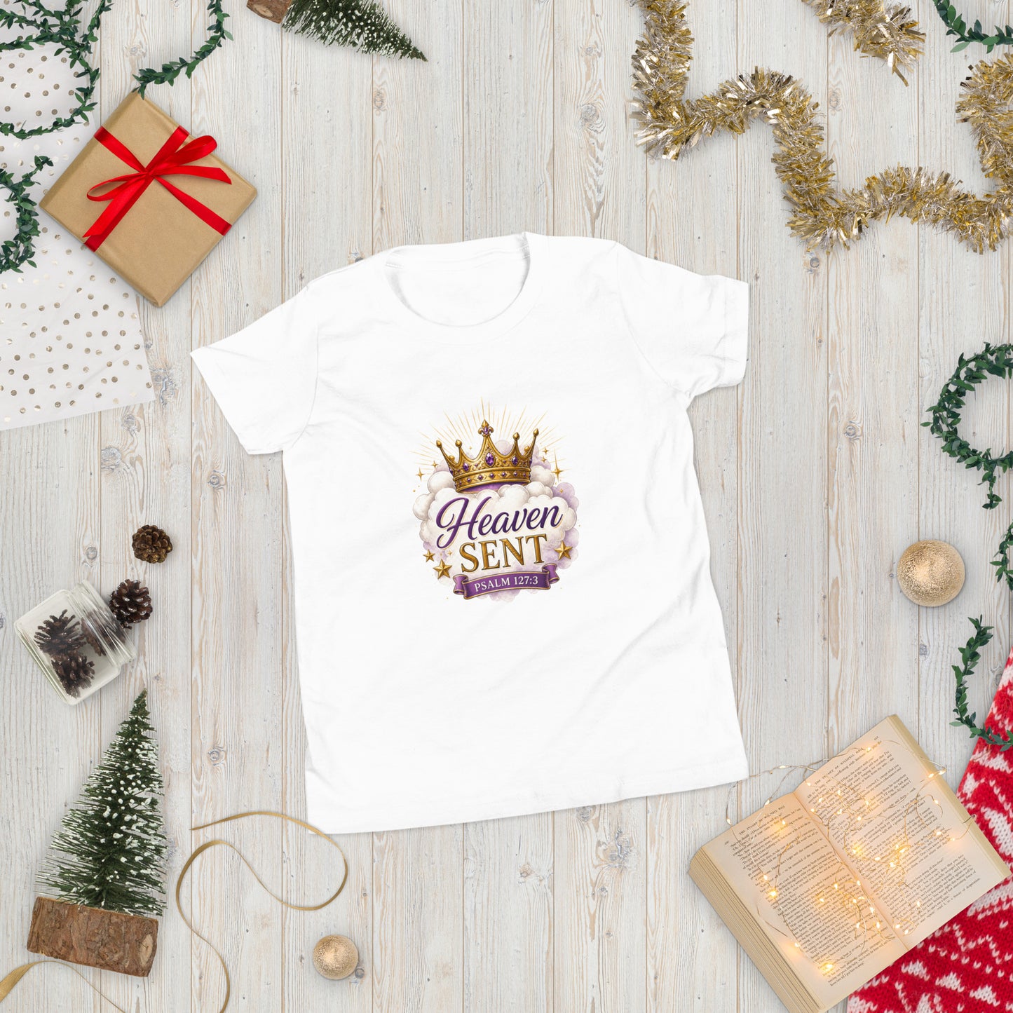 Christian “Heaven Sent” children’s design featuring elegant script typography, heavenly clouds, gold crown, and Psalm 127:3 on a white kids t-shirt.